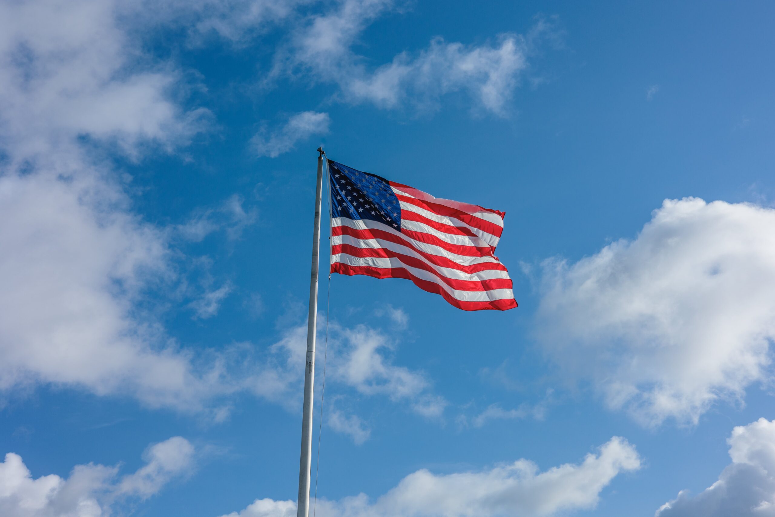 American flag against a blue sky