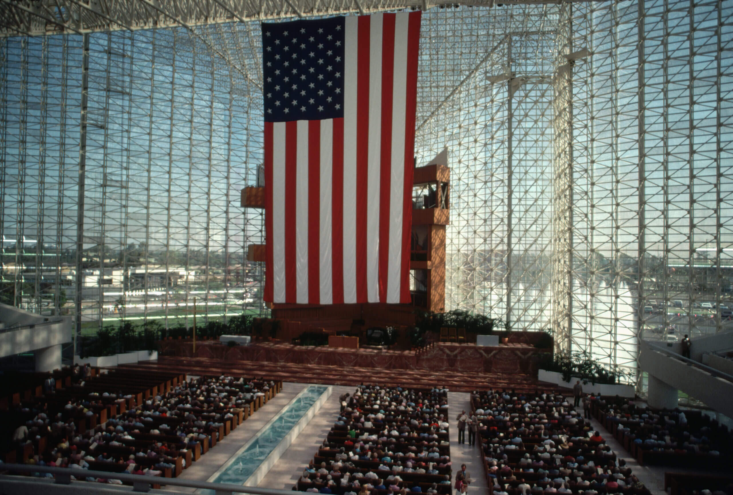 Congregation of the Crystal Cathedral gathers under the American flag. (Vince Streano/Corbis Documentary via Getty Images)