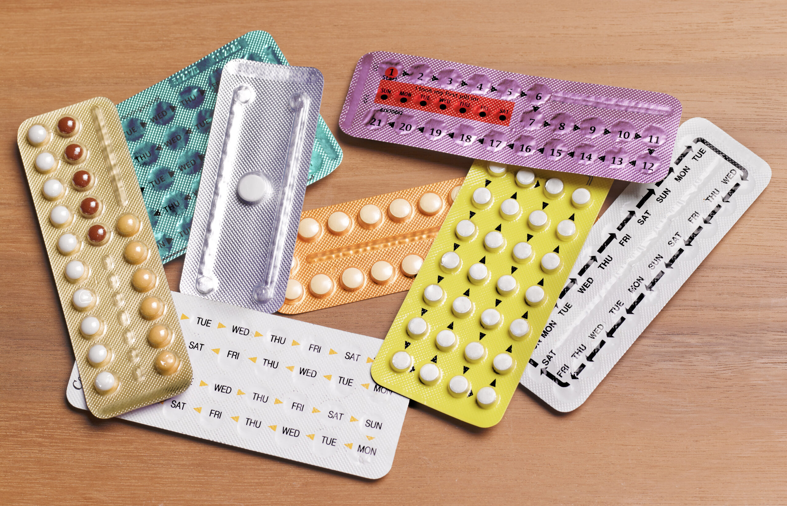 Packs of colorful birth control pills on top of each other (Peter Dazeley/The Image Bank via Getty Images)