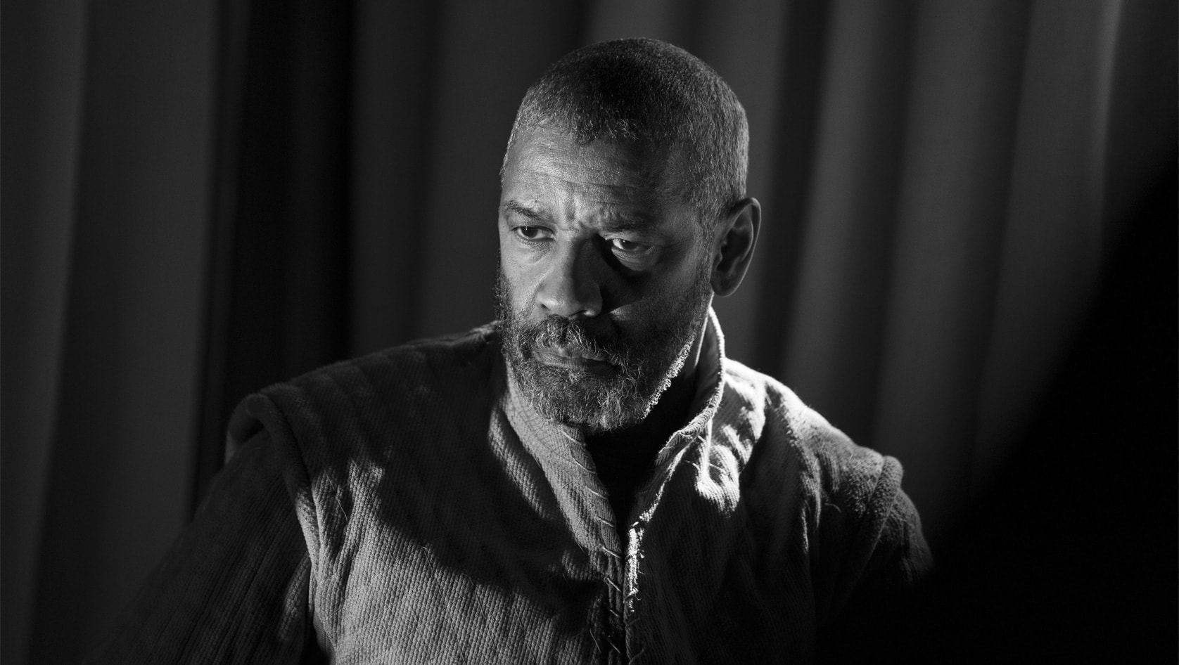 Denzel Washington stares to the side pensively as Macbeth in The Tragedy of Macbeth (Apple TV+ Press)