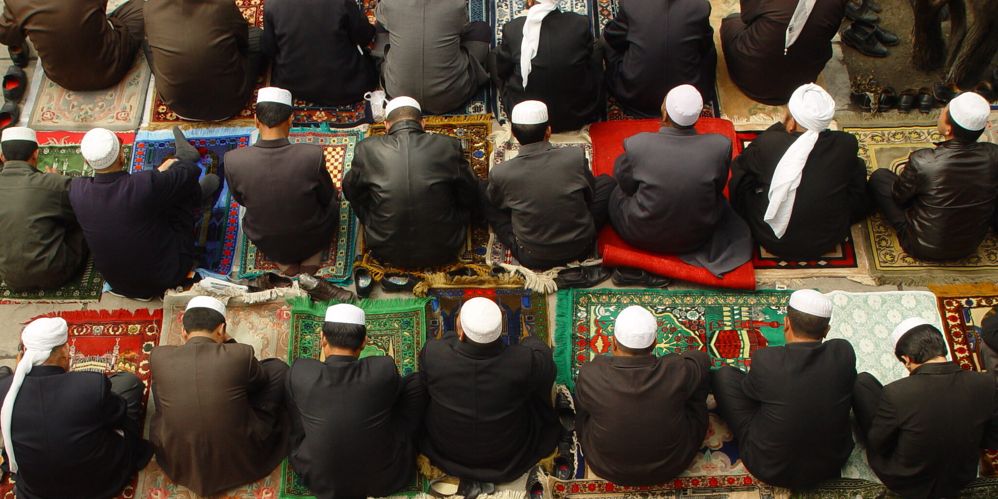 Aerial view of Muslims on prayer mats at Dongguan Mosque in Xining City, China (Leo Li/Moment via Getty Images)