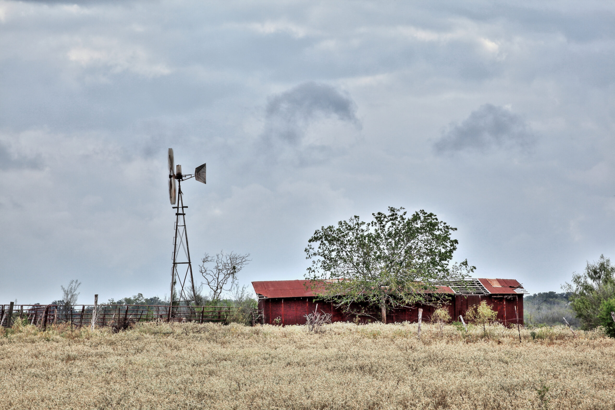 A red barn and windmill near Fentress Texas (Chester Leeds/Getty Images)